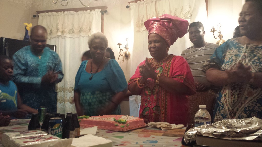Madam Cecilia Omorotionmwan (3rd from right) with family members and friends during prayer. Second from left is her son.
