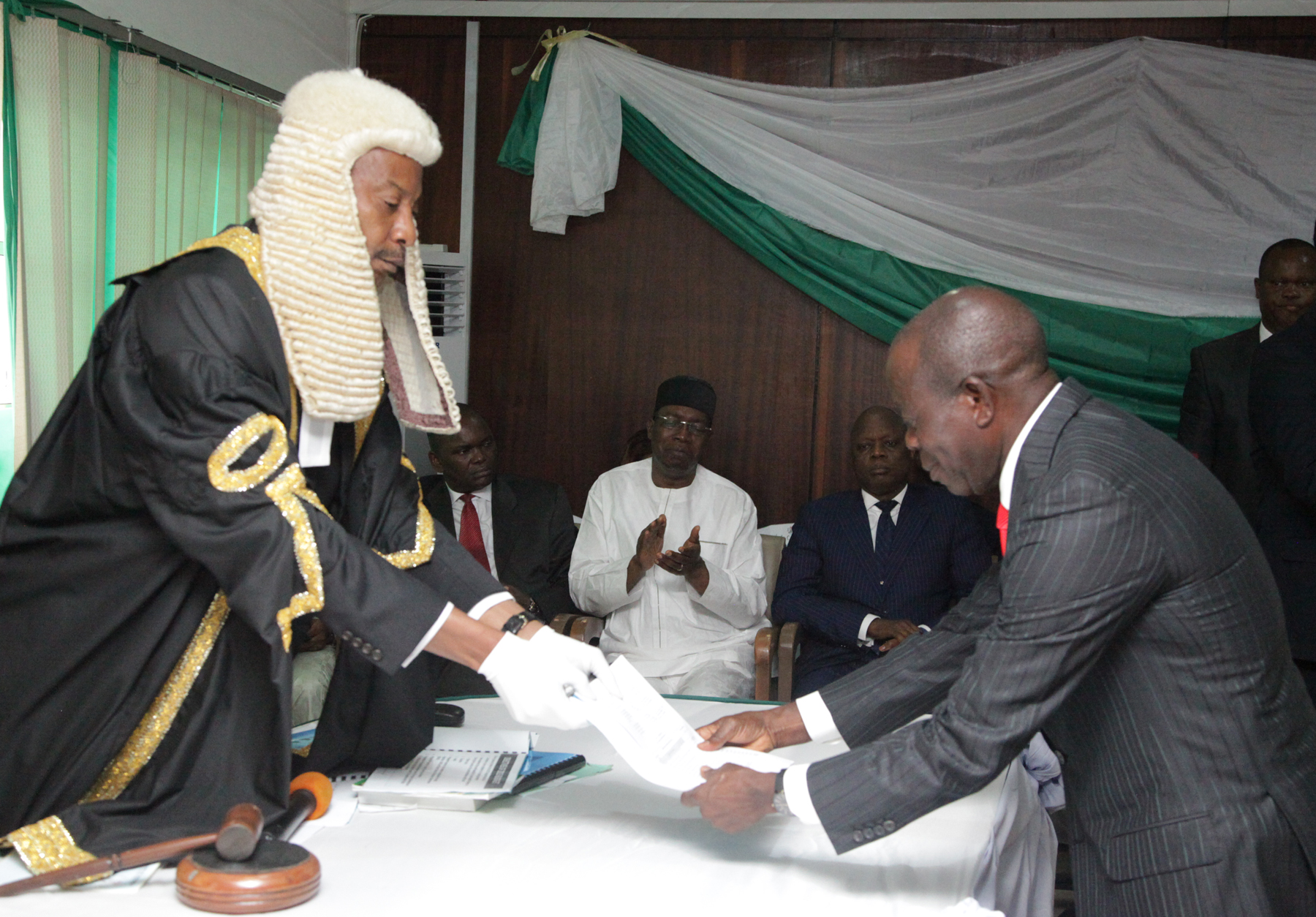 Governor Adams Oshiomhole Edo State presents a copy of the State's 2015 Budget to Rt. Hon Uyi Igbe, Speaker, Edo State House of Assembly at the presentation of the state's 2015 budget, yesterday (Tuesday). Photo by Alltimepost.com