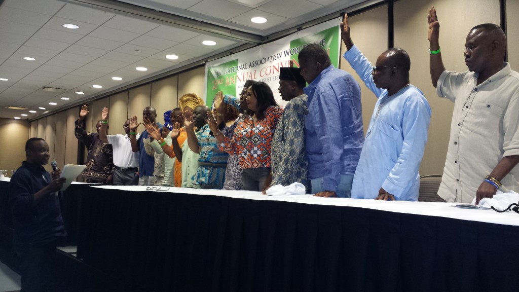 Photo, By Alltimepost.com shows members of the Executive and Board of Advisors, Edo National Association Worldwide being sworn in