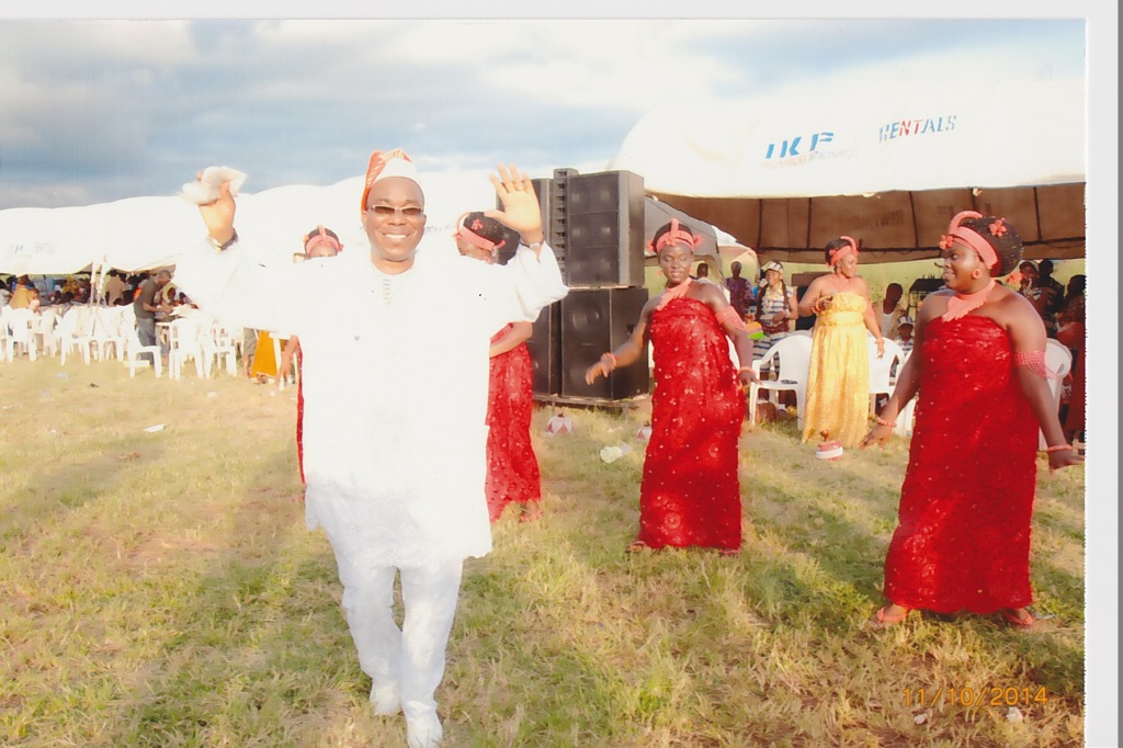 Mr. Osagie Igbinosun, admiring cultural display in honor  of his late mom.