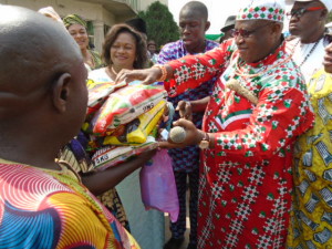 Edo-PDP-Chairman-Chief-Dan-Orbih-handing-a-widow-with-bags-of-rice-at-the-partys-secretariat-in-Benin-City-during-the-hosting-of-widows-in-Edo-State-by-the-party.-Photo-By-Ola-Airenakho..jpg