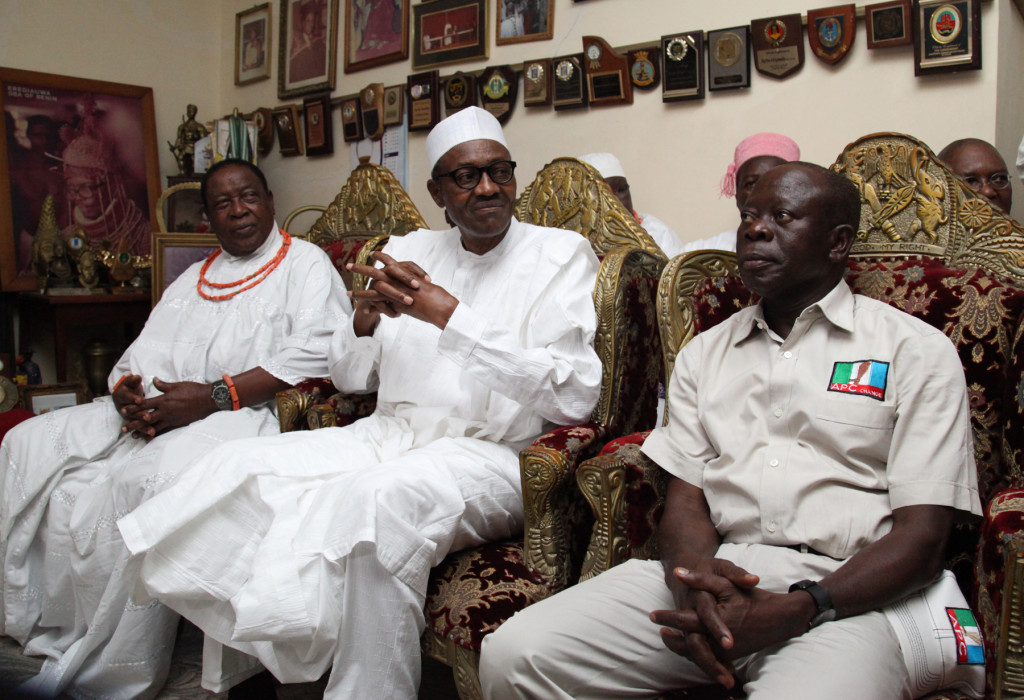 Major-General Muhammadu Buhari, Presidential candidate of the All Progressives Congress (APC) flanked by Chief John Oviasogie, Eribo of Benin Kingdom and Governor Adams Oshiomhole during the APC Presidential Candidate's visit to the Oba of Benin in his palace, Thursday.