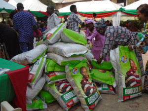 Widows-admiring-bags-of-rice-given-away-by-the-Peoples-Democratic-Party-during-the-hosting-of-widows-in-the-state-by-the-party.-Photo-By-Ola-Airenakho..jpg