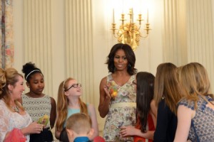 First Lady Michelle Obama speaks to military children at the White House during a Mother's Day tea honoring military mothers, May 8, 2015. Military spouses and children, service members who are mothers, mothers with children in the military, and Gold Star mothers were among those who attended the event. Army News Service photo by Lisa Ferdinando