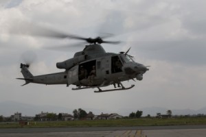 A U.S. UH-1Y Huey helicopter flies into the Tribhuvan International Airport in Kathmandu, Nepal, after conducting a search-and-rescue operation for a missing U.S. Marine Corps helicopter, May 13, 2015. U.S. Marine Corps photo by Cpl. Thor J. Larson