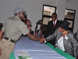 Governor Adams Oshiomhole of Edo State congratultaes Mrs Caroline Avielele after being sworn in as a Permanent Secretary in the State Civil Service, on Monday