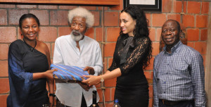 Mrs Iara Oshiomhole presents a souvenir to Mrs Folake Soyinka during the hosting of Governor Oshiomhole and his wife, by Professor Wole Soyinka and his wife, in their Abeokuta home, yesterday