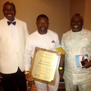 Lancelot Oduwa Imasuen (center) displays his Eghoba Global Presidential Award plaque recently presented to him in London in recognition of his excellent work in movie production and promotion of Edo Cultural