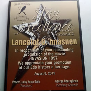Lancelot Oduwa Imasue's Award of Star excellence for  outstanding production of the movie, Invasion 1897 presented by Akugbeoretin Club of Chicago