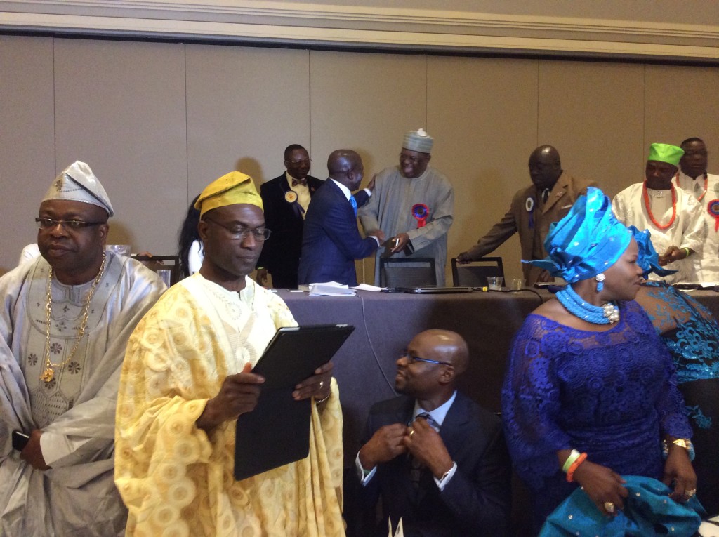 APC gubernatorial hopeful in Edo State, Engr. Chris Osa  Ogiemwonyi exchanges pleasantaries with Governor Adams Oshiomhole (both on  the podium) at Edo National Association Convention in Los Angel