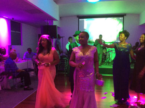A cross section of guests dancing with Dr. and Mrs. Omoigui at the event.