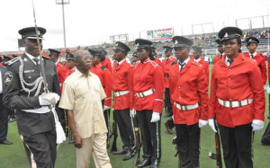 Governor Adams Oshiomhole of Edo State inspects the parade mounted by men of the Nigeria Police to mark Nigeria's 55th Independence Anniversary, in Benin City, on Thursday