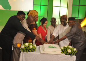 Governor Adams Oshiomhole (3rd right) flanked byChief John Odigie-Oyegun, National Chairman, All Progressive Congress (ANC) (2nd right), Mrs Iara Oshiomhole (4th left), Hon Pally Iriase, Deputy Chief Whip, House of Representatives (left); Dr Pius Odubu, Deputy Governor (2nd left), his wife, Mrs Endurance Odubu (3rd left) and Mr Anselm Ojezua, State Chairman, All Progressive Congress (ANC) cut the 7th Anniversary cake to celebrate the 7th year of the administration of Governor Adams Oshiomhole of Edo State, Thursday.