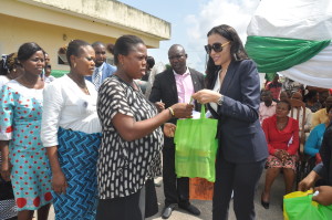 Mrs Iara Oshiomhole, wife of Edo State Governor, presents milk donated by the wife of the President, Hajia Aishat Buhari, to pregnant women and nursing mothers at the Stella Obasanjo Hospital, Benin City, yesterday