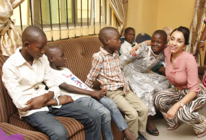 MILK OF KINDNESS: Mrs Iara Oshiomhole with orphans at Cornestone of Hope Orphanage during her continuous visit to orphanages in Edo State to present relief items to children in the homes.