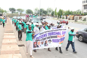 ANEEJ Executive Director, Rev. David Ugolor, leading the   protest against Panama papers scandal in Abuja on Tuesday.