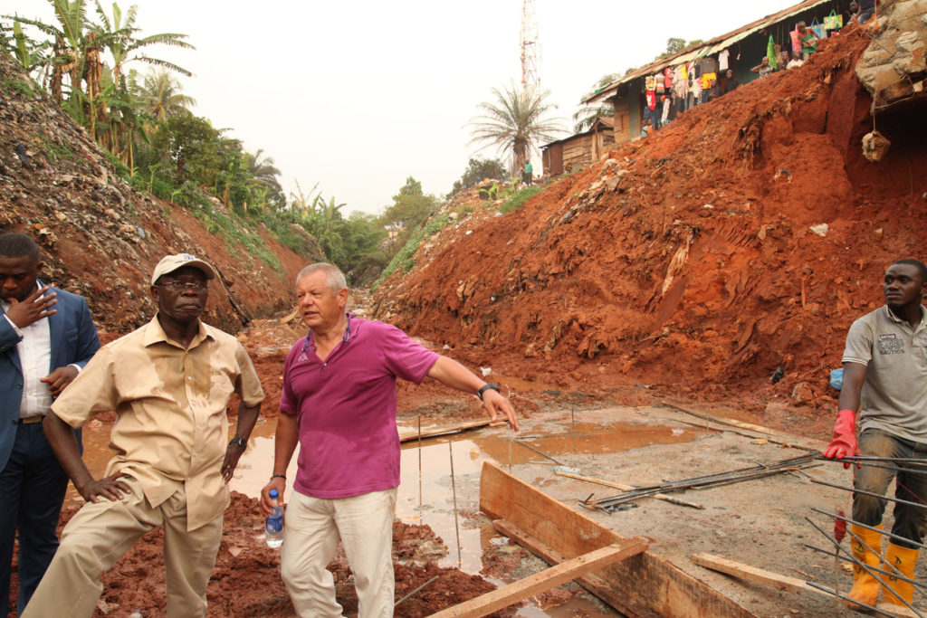 Governor Adams Oshiomhole of Edo State and Mr. Paulo Pistolesi, Area Manager, Hartland Nigeria Limited during the inspection of the underground drain at Upper Sokponba area of Benin City, on Tuesday. 