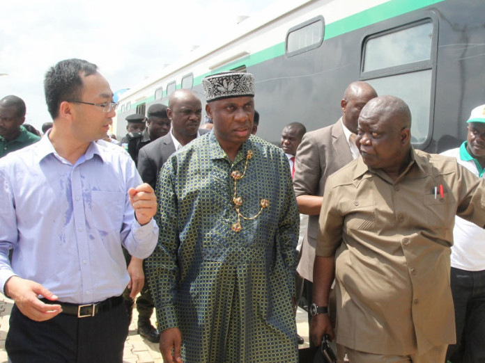 Minister of Transportation Chibuike Rotimi Amaechi, (middle) with the Managing Director, China Civil Engineering Construction Corporation Ltd. (CCECC) Jack Li (left) and Mr Fidel Okhiria, Acting Managing Director of the Nigerian Railway Corporation.(right) during the test run of the newly built Rail line from Abuja(Idu) to Kaduna