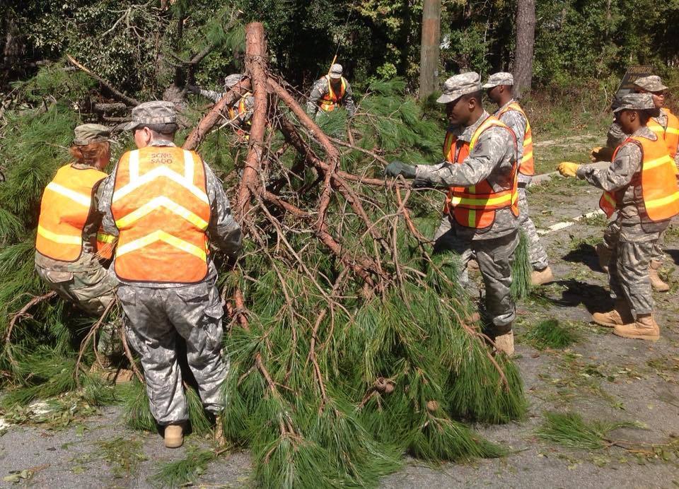 South Carolina National Guard soldiers with the 1263rd Forward Support Company remove tree debris from highway SC 46 in Bluffton, S.C., Oct. 9, 2016, in the aftermath of Hurricane Matthew. About 2,800 South Carolina National Guard soldiers and airmen were activated to support state and county emergency management agencies and local first responders after Gov. Nikki Haley declared a state of emergency. National Guard photo by Army Sgt. 1st Class Joe Cashion